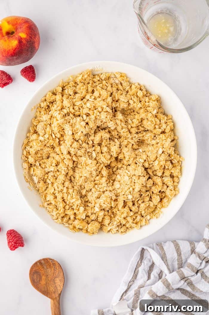 The finished crumble topping mixture, showing beautiful buttery clumps ready to be spread over the fruit filling.
