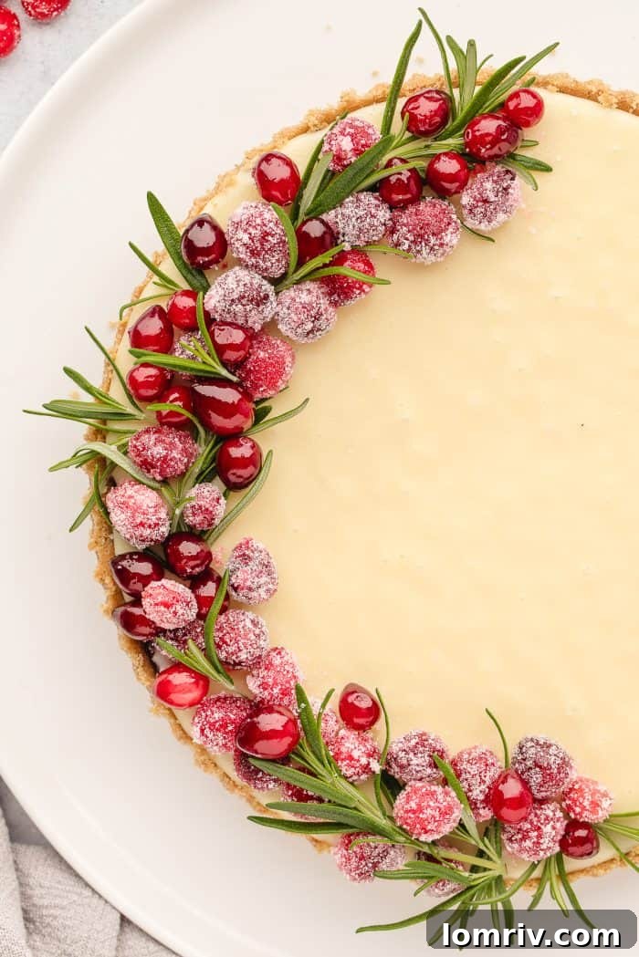 A detailed view of the exquisitely decorated white chocolate cranberry tart.