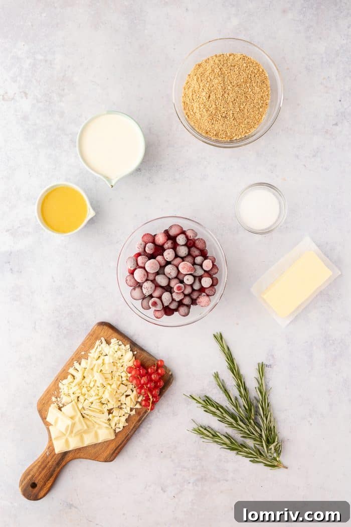 A flat lay photograph showcasing all the fresh ingredients required for making a white chocolate cranberry tart.