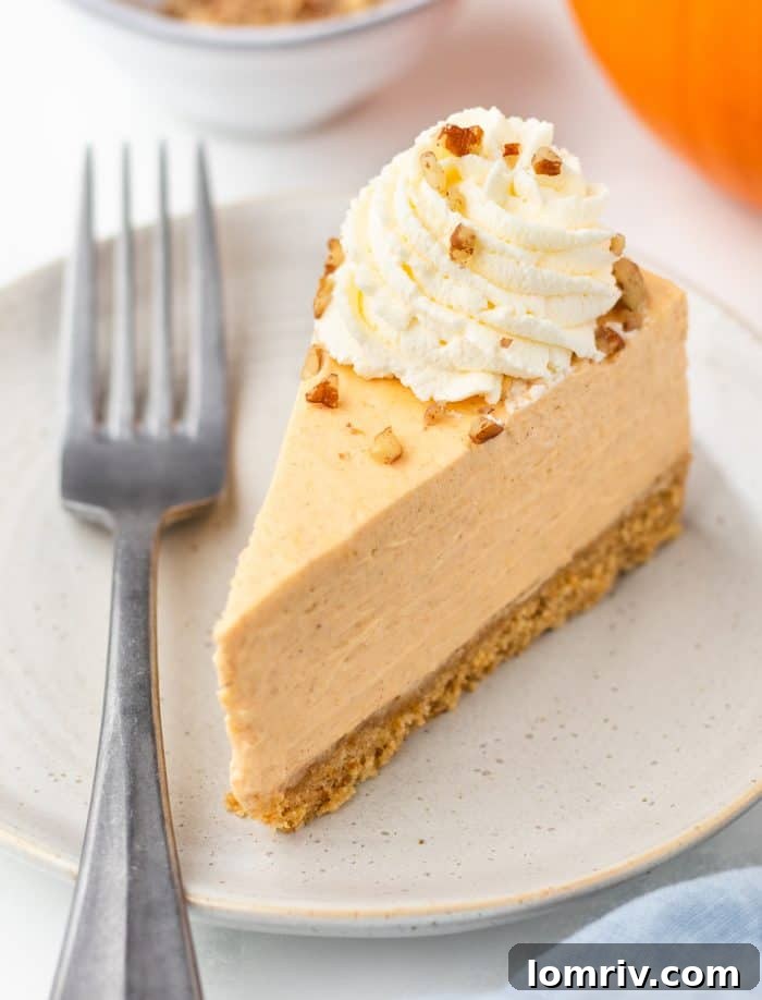 A delightful slice of pumpkin cheesecake resting on a plate, with artistic blur of decorative pumpkins in the background, setting a warm autumn scene.