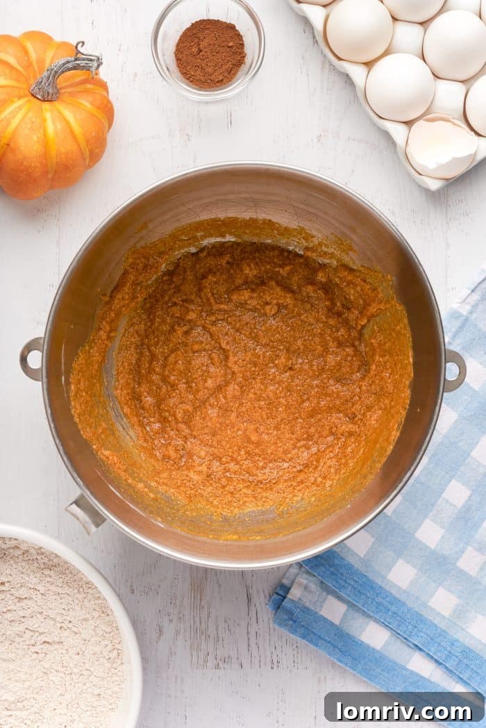 The pumpkin puree is mixed with the other wet ingredients.