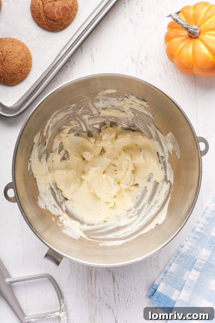 A mixing bowl with cream cheese that has been mixed.
