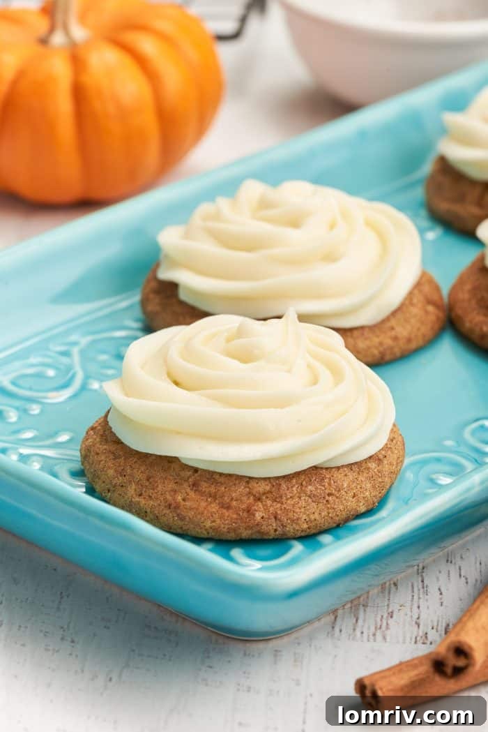 A blue plate with 4 pumpkin snickerdoodles.