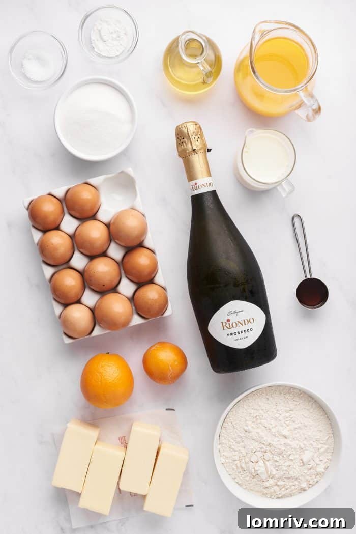 Various ingredients for mimosa cupcakes, neatly arranged in separate bowls. These include flour, eggs, sugar, butter, and citrus, all ready for baking.