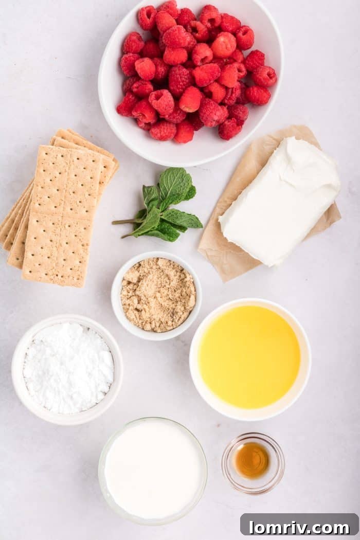 Bowls of fresh ingredients laid out for making raspberry mousse.