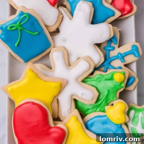 Beautifully decorated Christmas sugar cookies with royal icing, shaped like stars and gingerbread men.