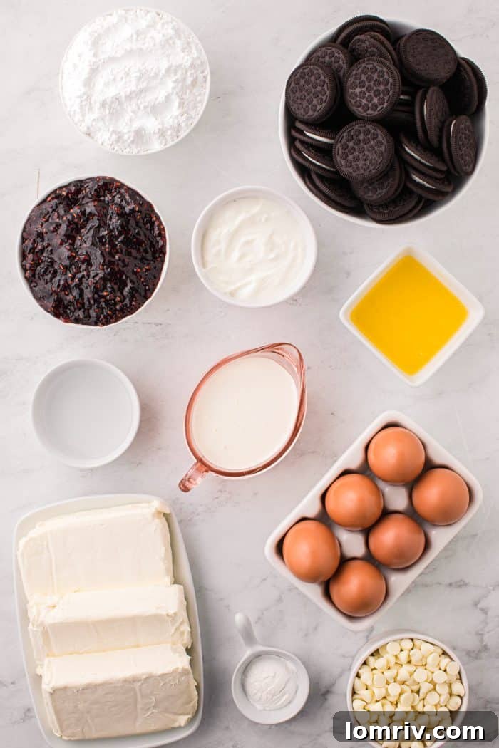 A beautiful flat lay photograph showcasing all the fresh ingredients needed to make white chocolate raspberry cheesecake bars.