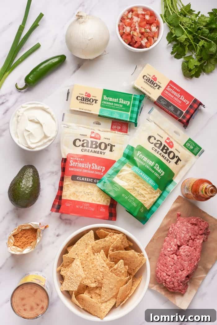 The ingredients for sheet pan nachos with packages of cheese and tortilla chips.