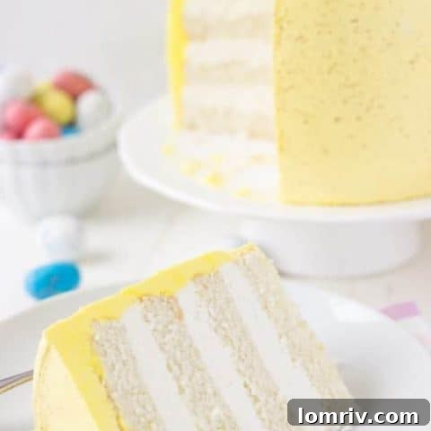 A beautifully decorated speckled Easter cake, infused with coconut and lemon, frosted with yellow-speckled Swiss meringue buttercream.