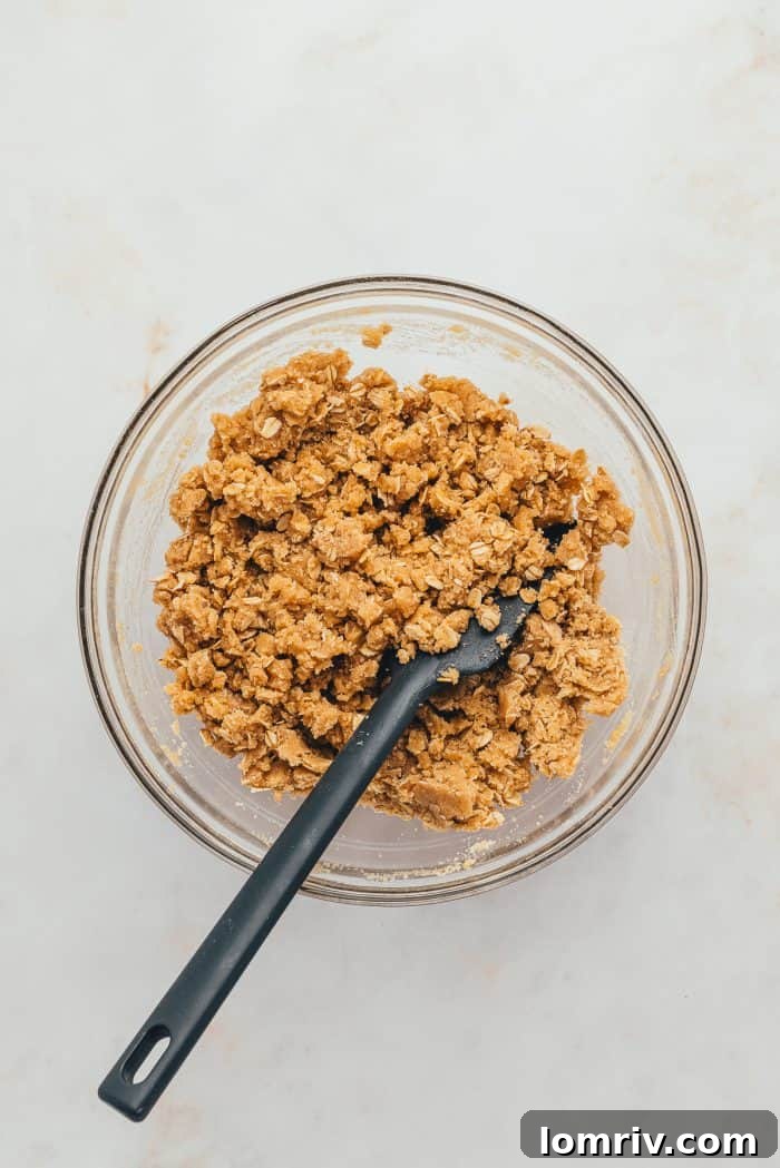 A glass bowl with the crumble topping. 