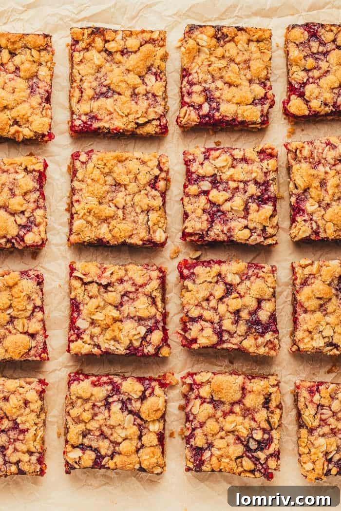 Raspberry Crumble Bars cut into slices.