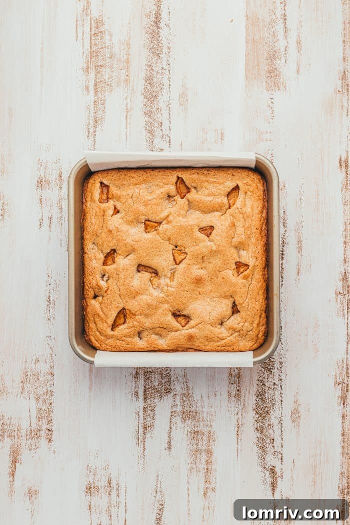 A square baking pan with baked apple pie blondies.