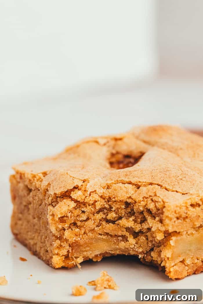 The closeup of an Apple Blondie with a bite taken out of it.
