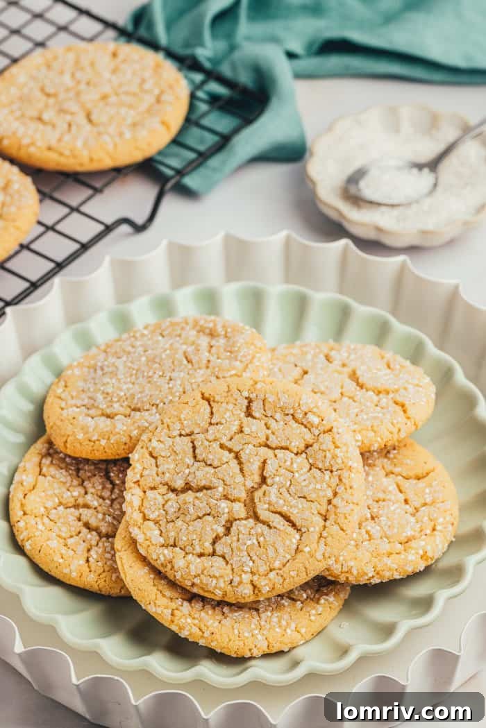 A green plate with various browned butter cookies, beautifully golden brown.