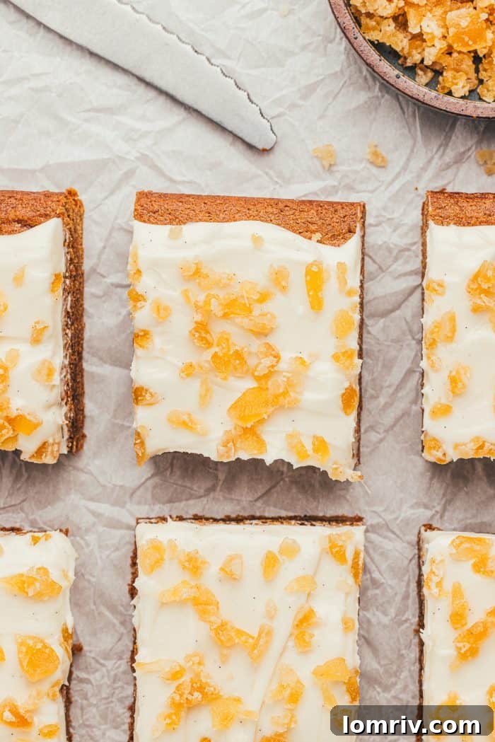 Frosted gingerbread bars, cut into perfect squares, arranged neatly in the baking pan.