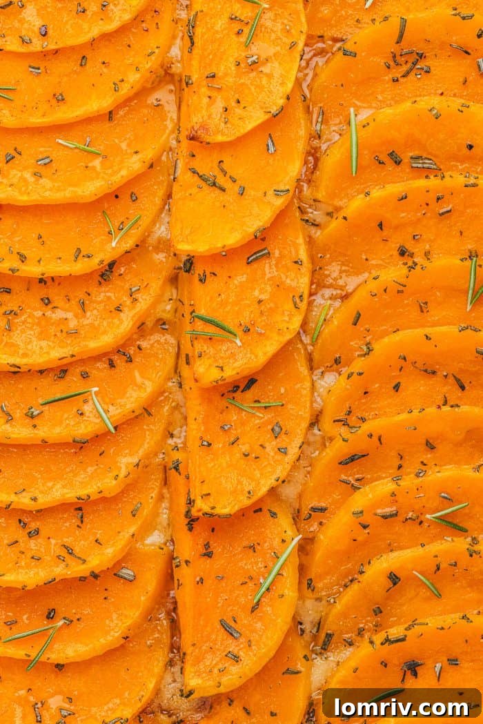 A tantalizing close-up of the baked butternut squash tart filling, showcasing its caramelized edges.