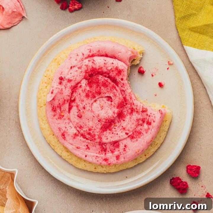 A lemon sugar cookie on a white plate.