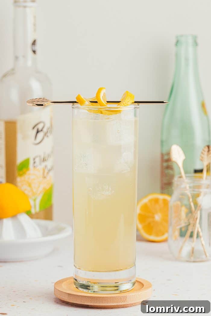 A refreshing lemon elderflower mocktail garnished with a fresh lemon slice, perfect for spring.
