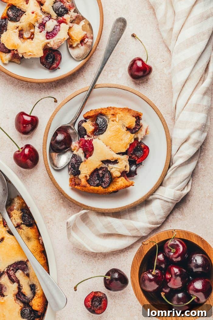 A plate with a scoop of browned butter cherry cobbler.