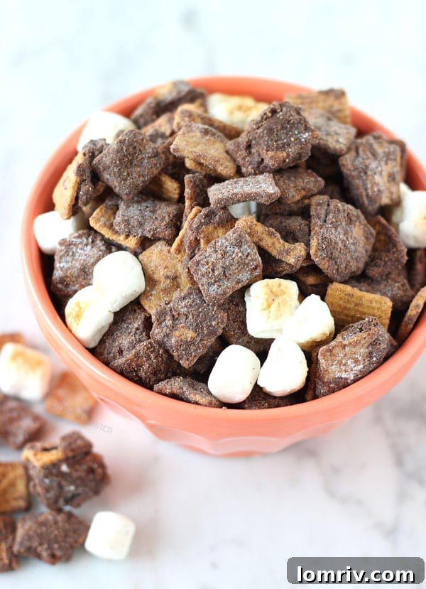 Pile of Peanut Butter S'mores Muddy Buddies in a bowl