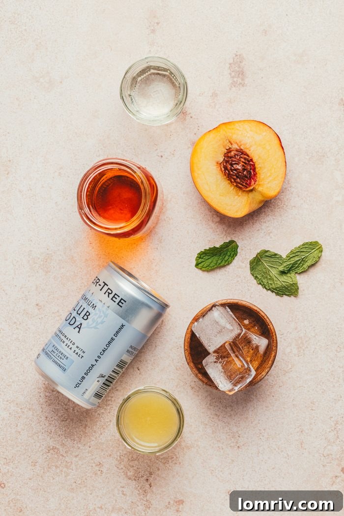 The ingredients to make a bourbon peach smash.
