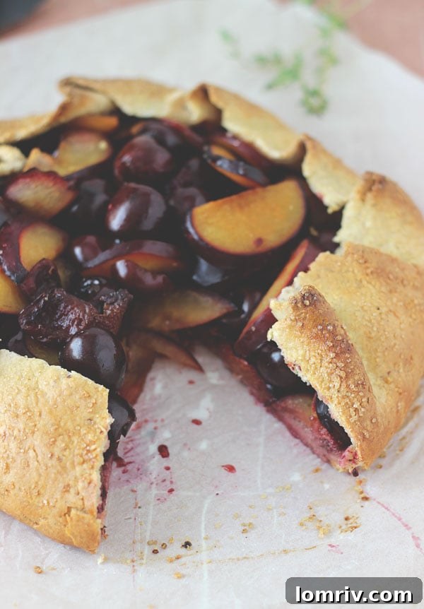 Beautifully baked Cherry Plum Hazelnut Galette cooling on a wire rack.