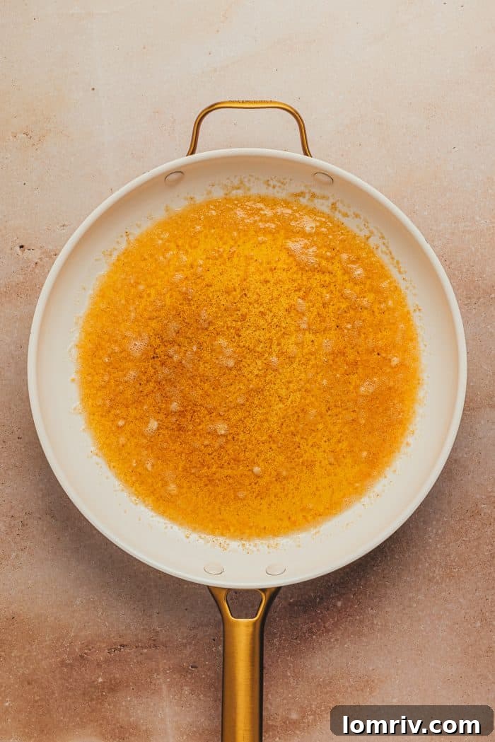 Melted butter in a skillet.