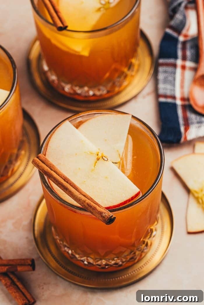 A close-up shot of the Apple Cider Old Fashioned, inviting you to take a sip.