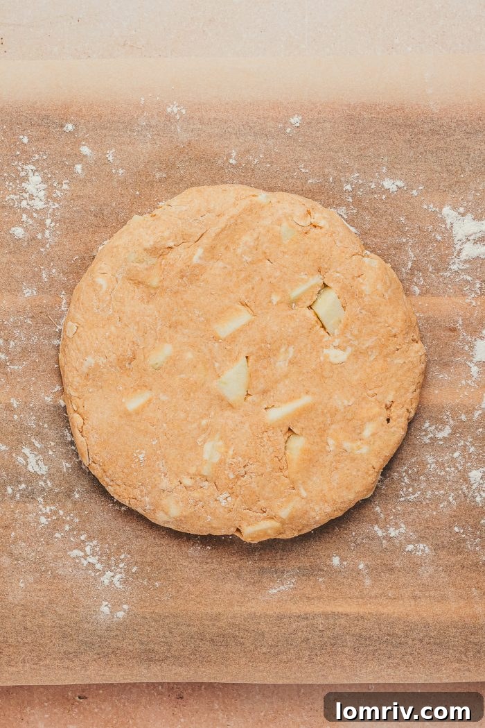 The disc of scone dough cut into 8 pieces.