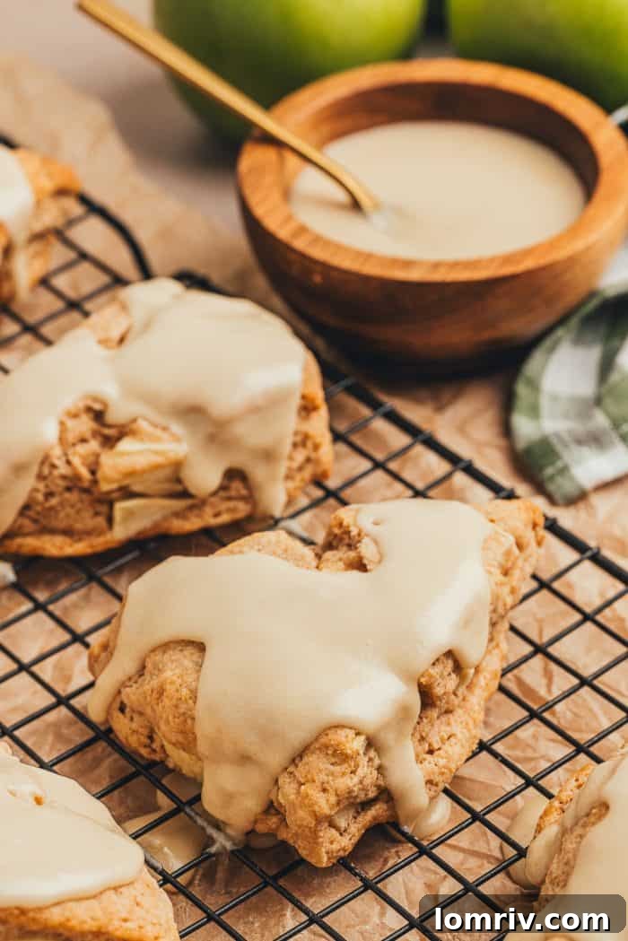 Apple cinnamon scones on a wire rack.