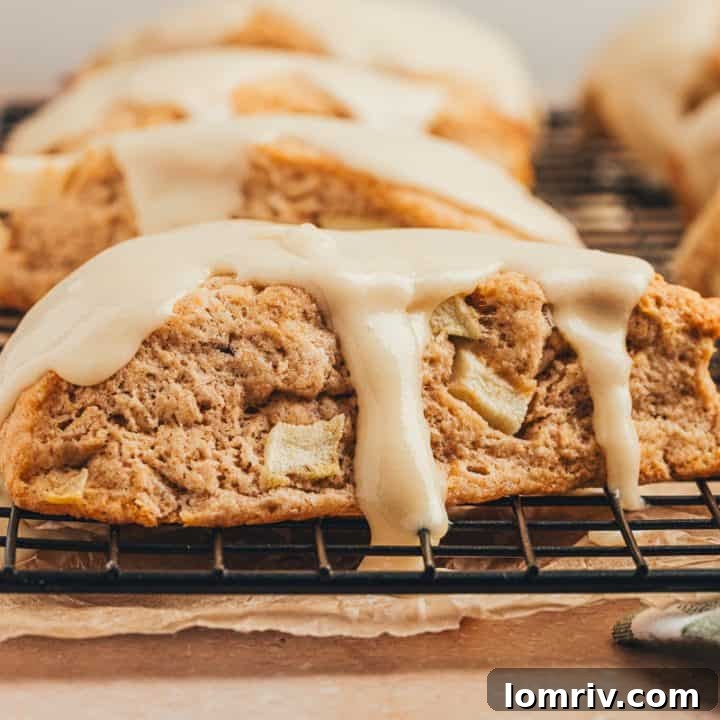 Apple cinnamon scones on a wire rack.
