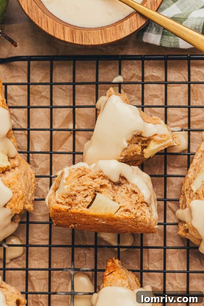 Apple cinnamon scones on a wire rack.