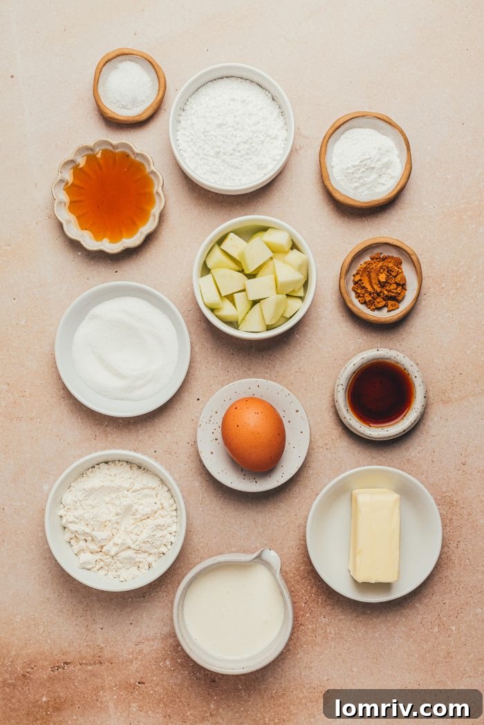 The ingredients for making apple cinnamon scones in various bowls.