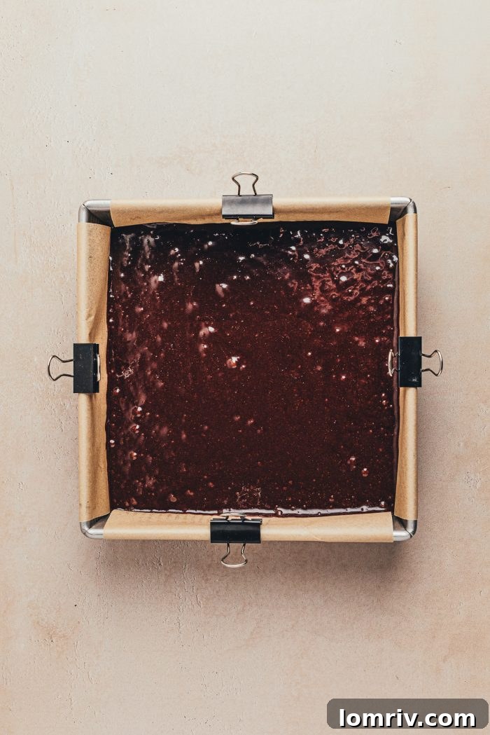 A square pan with brownie batter.
