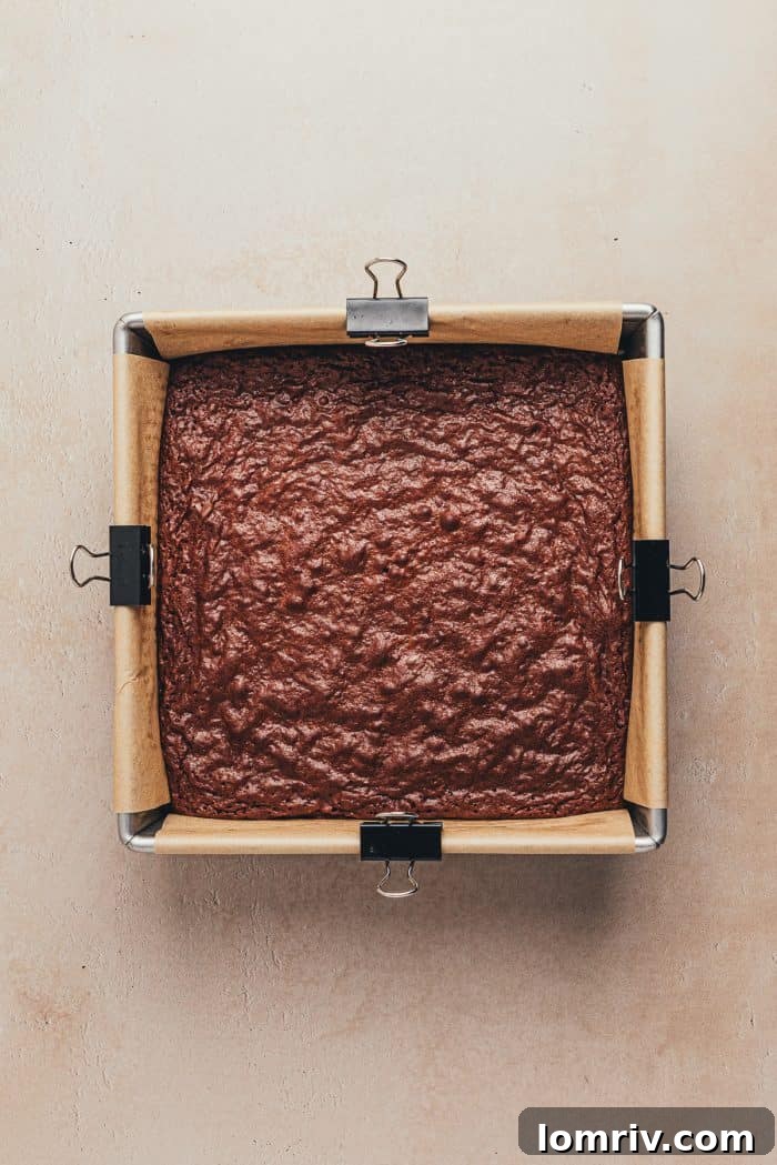 A square baking pan with baked brownies.