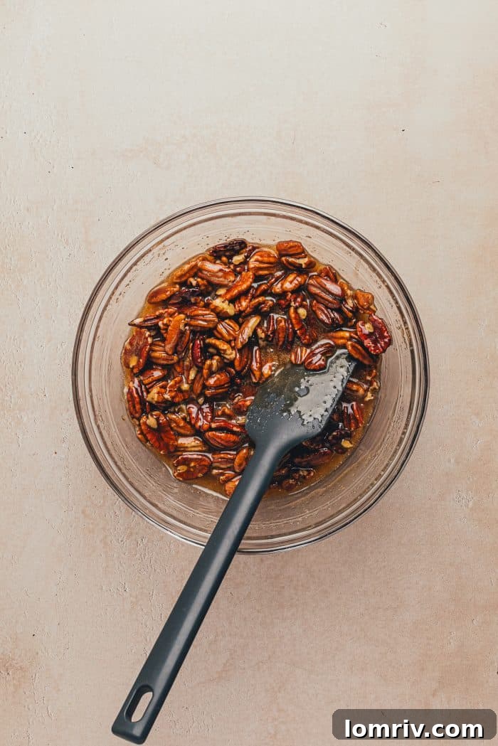 The pecan mixture in a glass bowl.