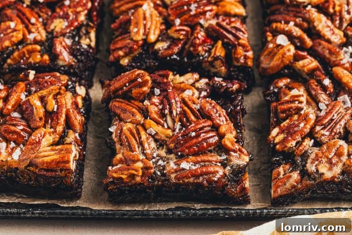 The sliced pecan pie brownies on a tray.