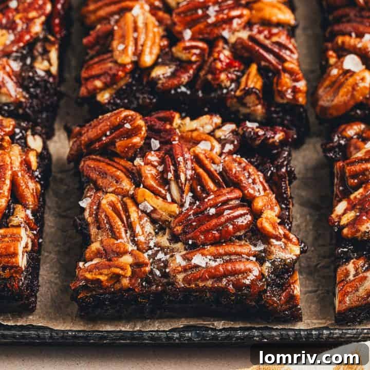The sliced pecan pie brownies on a tray.