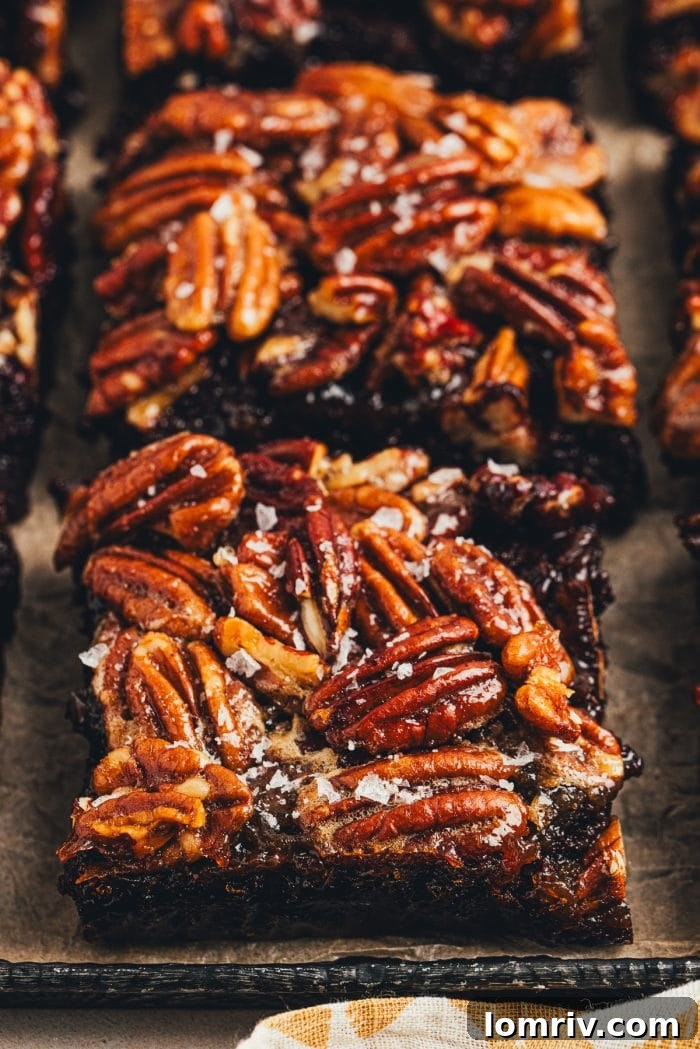 The sliced pecan pie brownies on a tray.