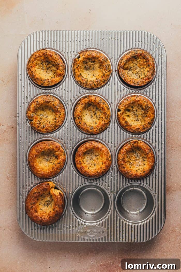 The baked rosemary popovers in a cupcake tray.