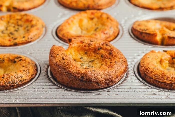 Herbed popovers in a baking tray.