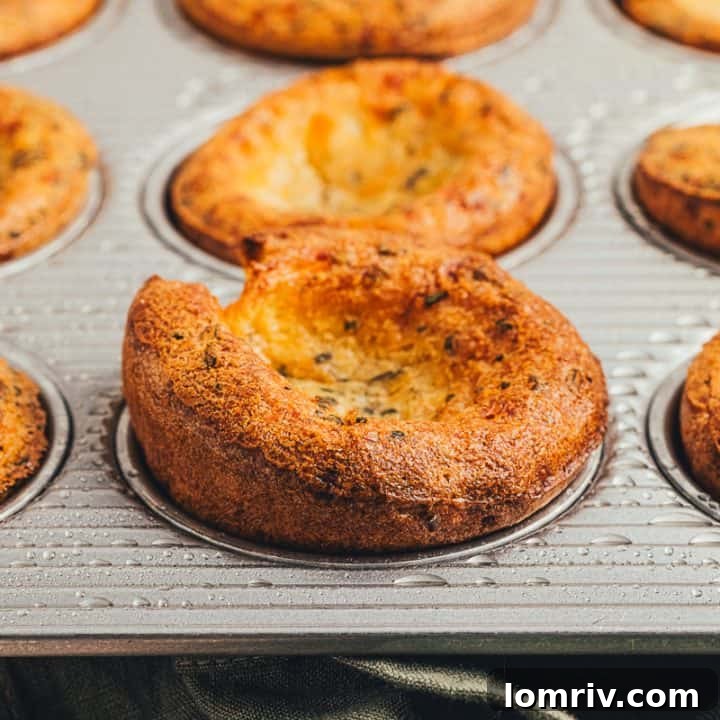 Herbed popovers in a baking tray.