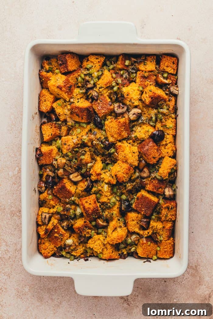 A white rectangle baking dish with baked stuffing.