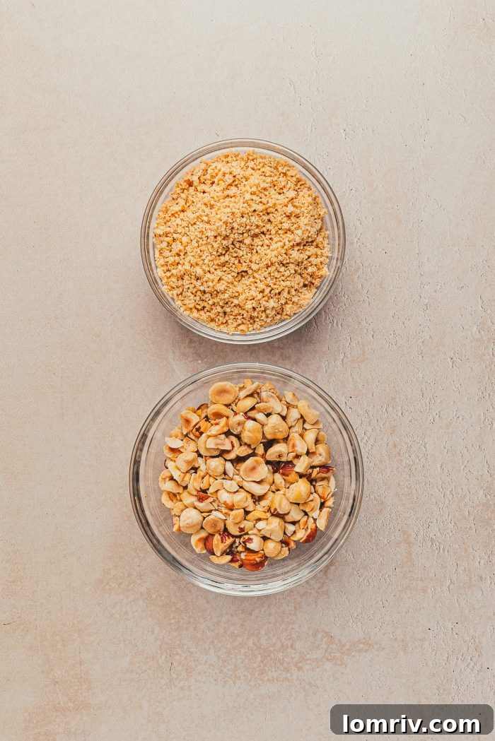 Two bowls of chopped hazelnuts; one roughly chopped and the other finely chopped, ready for use.