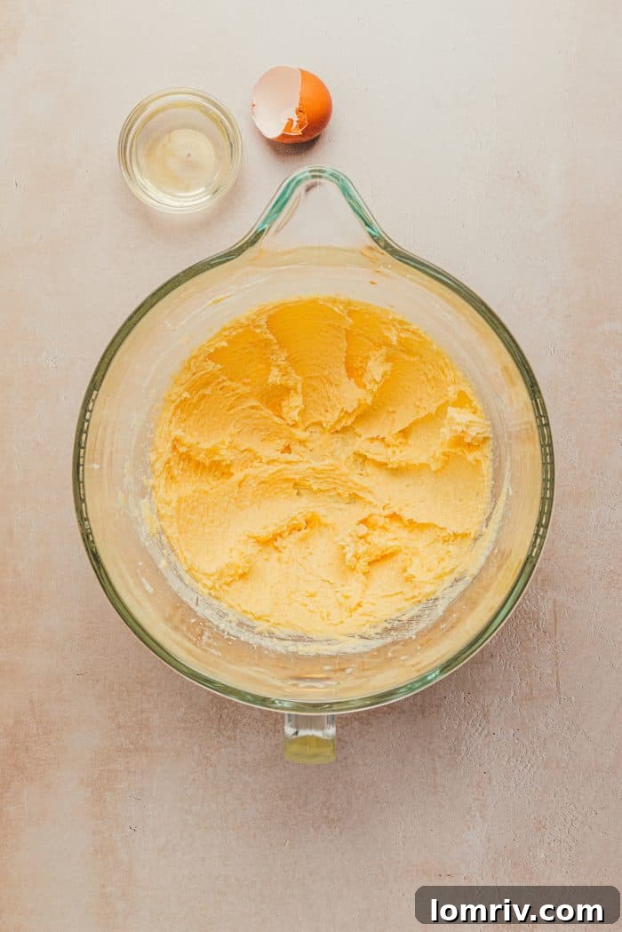 Softened butter in a mixing bowl, ready to be creamed.
