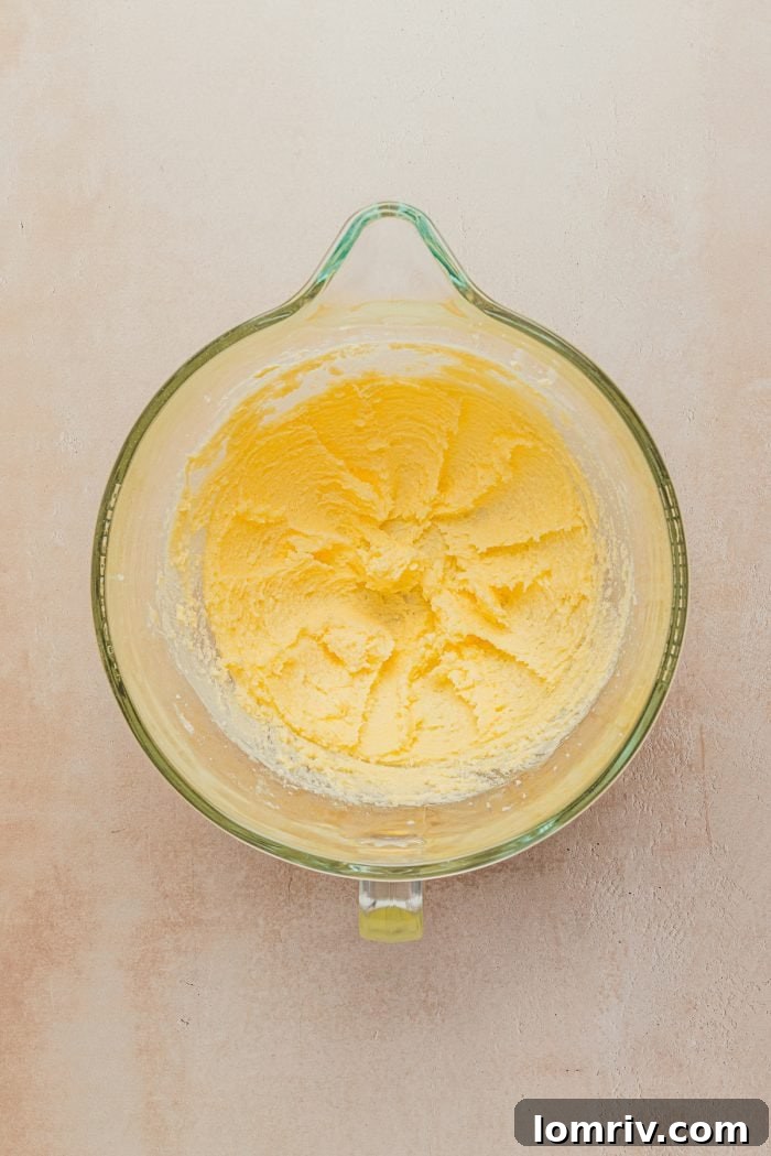 Creamed butter and sugar mixture in a bowl, ready for the next step.