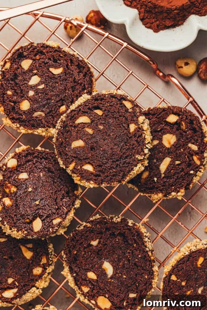 Chocolate hazelnut espresso shortbread cookies cooling on a wire rack after baking.
