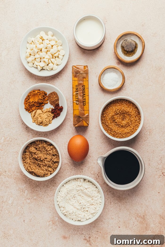 Various bowls with the ingredients for making gingerbread Thumbprint cookies.