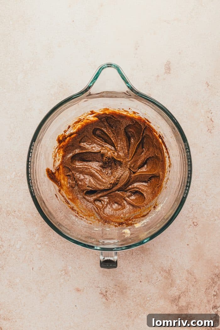 The wet ingredients mixed together in a glass bowl.