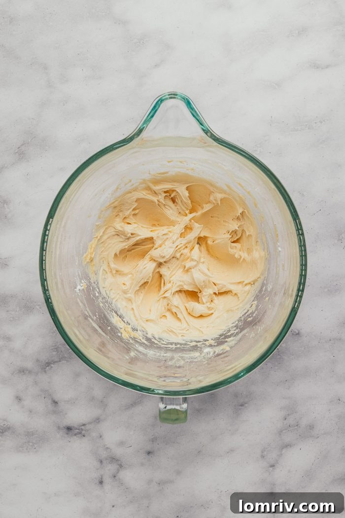The mixed batter in a glass mixing bowl.
